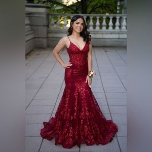 Beautiful, red Lyra gown used one time for prom. Size 2 with no alterations.